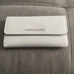 Gray Micheal Kors trifold wallet